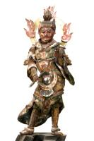炎の光背をつけて左腰を少し上げて足を肩幅に開いて立っている仏像の写真